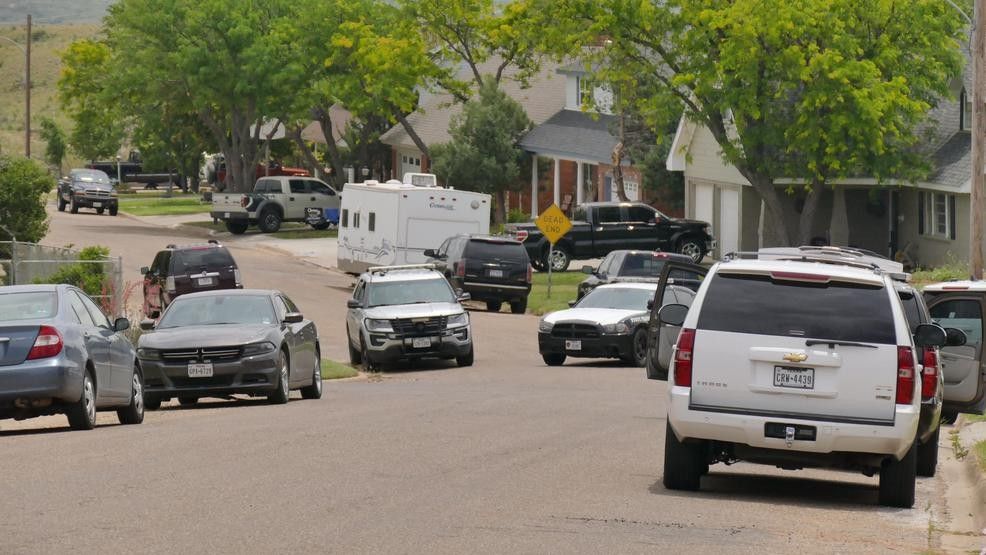 Police cars outside a home